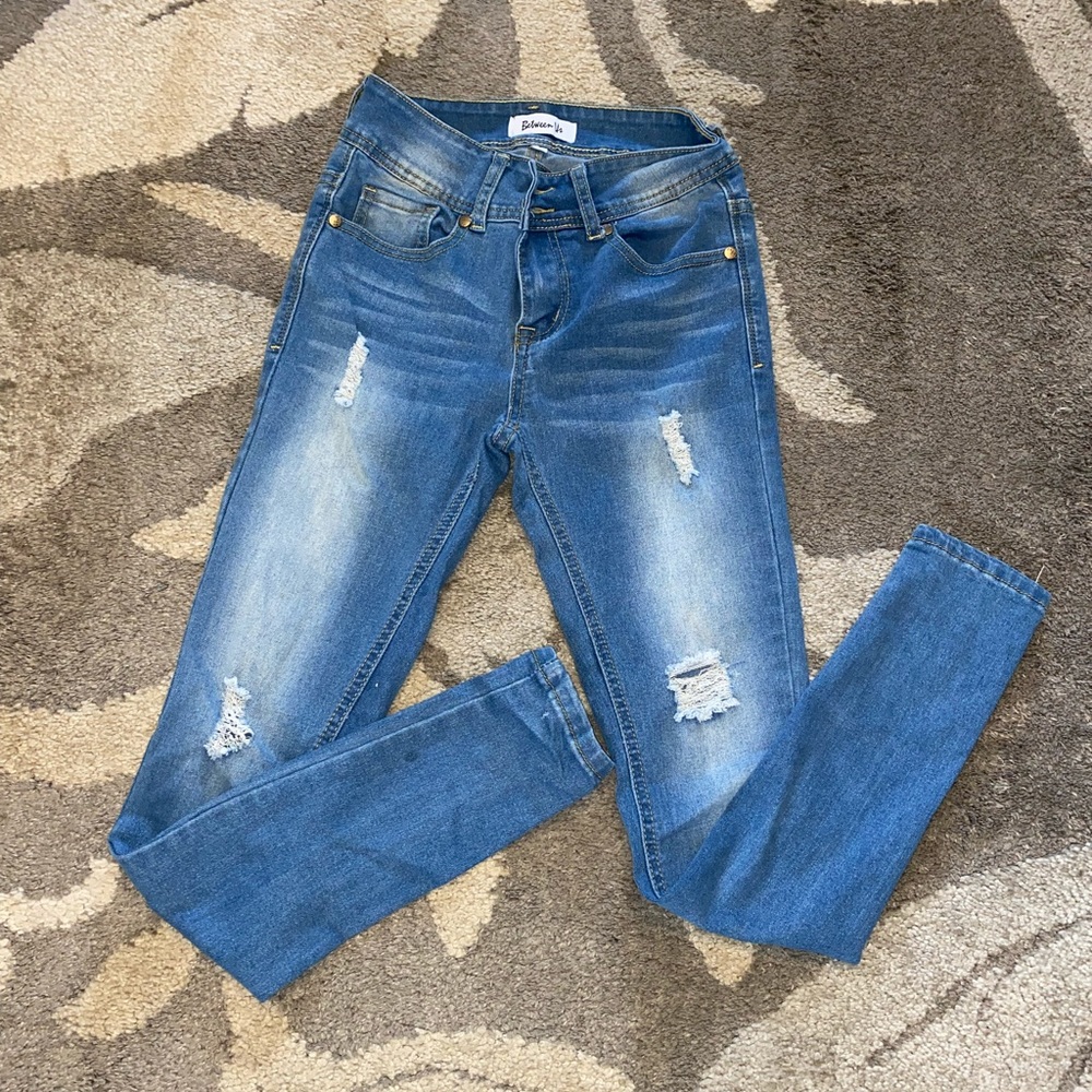 Size 1 slightly high waisted ripped jeans
